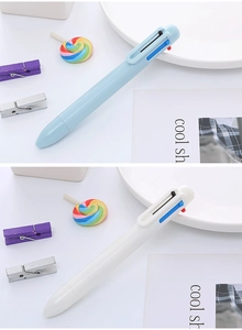 Dettaglio che mostra penne a sfera multicolore stile macaron con scatto a molla