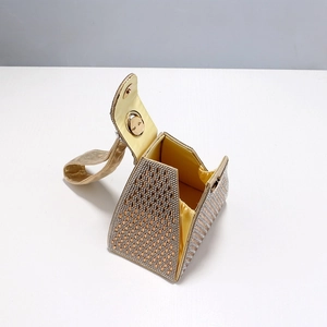 Golden triangle evening bag with sparkling rhinestones and elegant satin lining