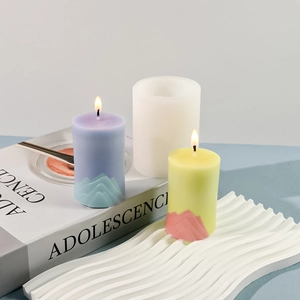Macro shot of mountain peak candle mold and finished lavender and yellow scented candles