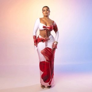 Detailed view of floral print two-piece set featuring drawstring crop top and high waist maxi skirt