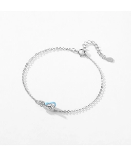 Detailed view of S925 sterling silver bow bracelet with blue enamel and crystal inlay