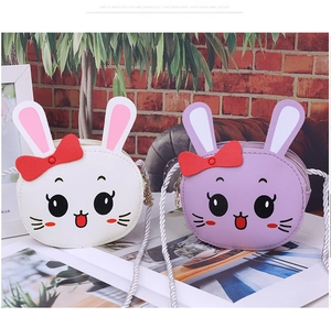 Detail of cute rabbit PU leather crossbody bags for kids in white and purple with bow
