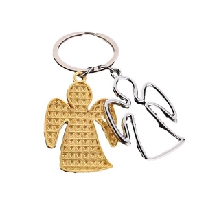 Polished metal angel keychain with gold grid and silver hollow pendants on white background