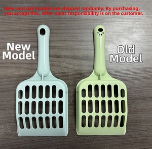 Detail of durable plastic cat litter scoops in light blue and green on a wooden surface
