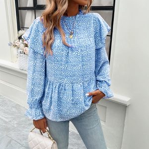 Elegant blue long sleeve floral blouse with white leopard print and ruffle details
