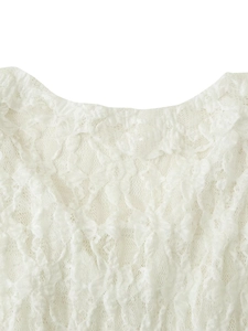 Close-up of white floral lace neckline detailing on an elegant knit top with ribbon