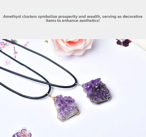 Macro shot of natural amethyst cluster pendants with gold and silver wire-wrapped details