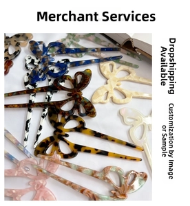 Close-up of butterfly acetate hair sticks in various marble patterns and tortoise shell colors