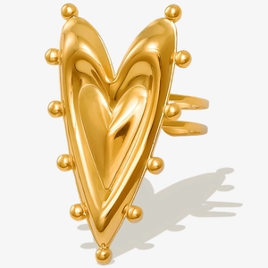 Detailed view of the 18K gold-plated heart ring with textured beaded edges and open band