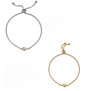 Detailed view of gold and silver steel birthstone bracelets with adjustable sliders