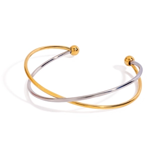 Polished two-tone stainless steel crossover open bangle with ball ends on white background