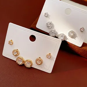 Elegant silver needle zircon stud earrings set featuring circular halo designs in gold and silver