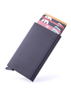 Close-up of black matte aluminum RFID card holder with automatic pop-up lever mechanism