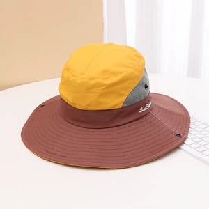 Detail of outdoor sun visor with yellow crown, grey mesh, and Sun Shade embroidery