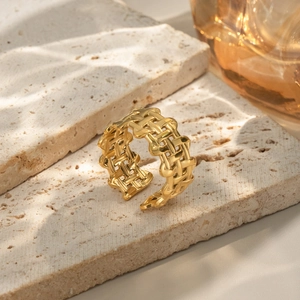 Adjustable gold geometric stainless steel ring featuring a woven hollow lattice design