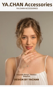 Close-up of elegant gold starburst earrings featuring natural stone inlay on a female model