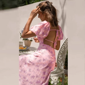 Detail of pink floral dress with puff sleeves and backless tie design in chiffon material