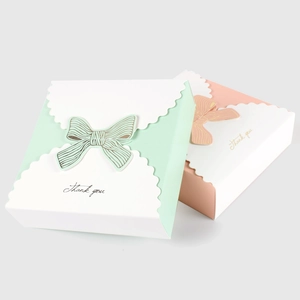 Pink and green paper gift boxes with bow ties and 'Thank you' cursive lettering details