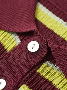 Macro view of burgundy and yellow-green striped knit polo shirt with pearl luster buttons