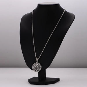 Retro Masonic stainless steel pendant necklace with winged relief on black mannequin