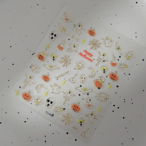 3D Halloween nail stickers with gold embossed ghosts, pumpkin lanterns, and spider webs