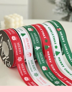 Detail of Merry Christmas grosgrain ribbons in red, green and white for gift wrapping