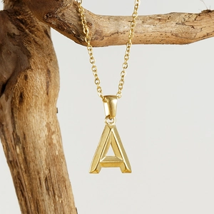 Minimalist 18K gold plated stainless steel initial A pendant necklace on wooden branch