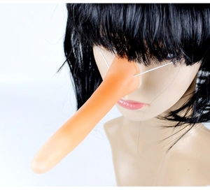 Detail of a flesh-colored long nose prop for Pinocchio cosplay with white elastic strap