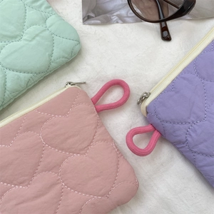 Quilted heart mini purses in mint green, pink, and purple with cotton rope handles