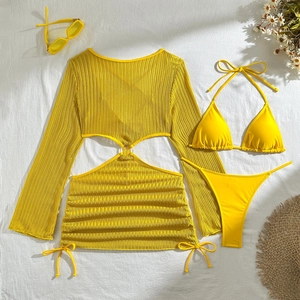 Detailed flat lay of a yellow three-piece crochet bikini set with mesh cover-up and ring detail