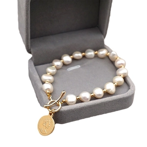 Baroque freshwater pearl bracelet with 18K gold coin pendant and vintage OT toggle clasp