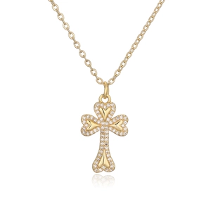 Detail of 18K gold plated cross pendant with zircon inlay and heart-shaped ends