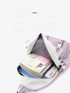 Top view of open purple and white backpack showing large capacity and internal compartments