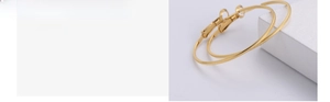 Detailed view of large gold hoop earrings with textured embossed finish and polished surface