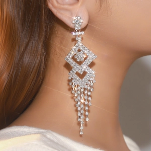 Elegant silver rhinestone drop earrings with geometric diamond shapes and long tassels