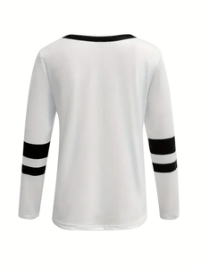 Detail of white long sleeve sweatshirt featuring black striped cuffs and back stitching