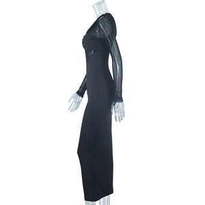 Detail of sheer mesh patchwork and ruched design on black bodycon midi dress