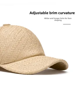 Close-up of beige woven straw baseball cap with a wide foldable brim and textured finish
