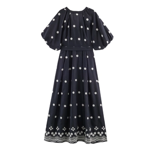Elegant navy blue V-neck maxi dress with white floral embroidery and puff sleeves