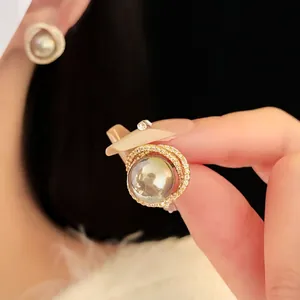 Elegant hollow gray pearl earrings with zircon halo and gold plated finish for women