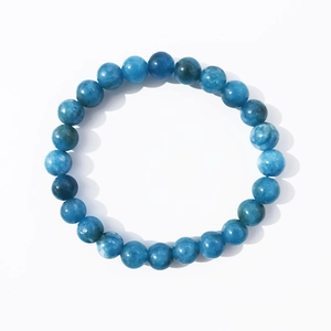 Handmade 8mm blue natural stone beaded bracelet with unique mineral textures on white background