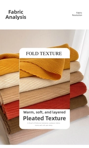 Close-up of stacked imitation cashmere scarves with soft pleated texture and warm tones