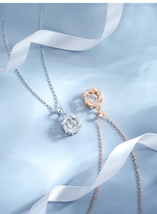 Macro detail of wheat ear pendant necklace in silver and rose gold with moissanite crystals