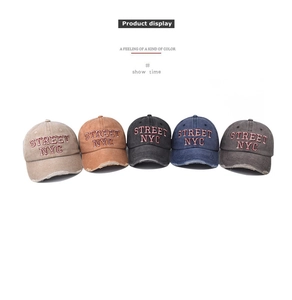 Detail of five distressed cotton baseball caps with red Street NYC embroidery and frayed brims