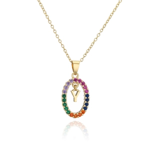 Close-up of gold-plated necklace with rainbow zircon halo and letter Y pendant