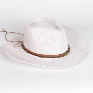 Close-up of white woven straw hat with brown leather band and gold star buckle detail