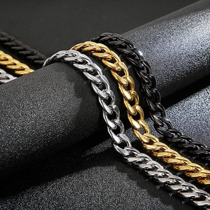 Classic stainless steel Cuban link chains in silver, gold, and black metallic finishes
