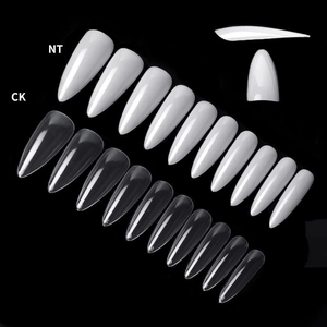 Macro detail of long stiletto nail tips in clear and solid white with size numbering
