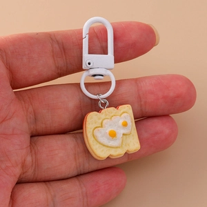 Creative toast keychain with heart-shaped fried eggs detail on high quality resin