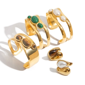 Set of gold stainless steel open bangles and rings with pearl and malachite stones